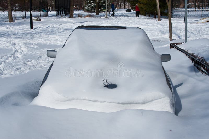 Car buried with snow following the 3rd worst blizzard in Chicago's recorded history. The storm left half the city without power and stranded over 400 cars on a major freeway. Car buried with snow following the 3rd worst blizzard in Chicago's recorded history. The storm left half the city without power and stranded over 400 cars on a major freeway.