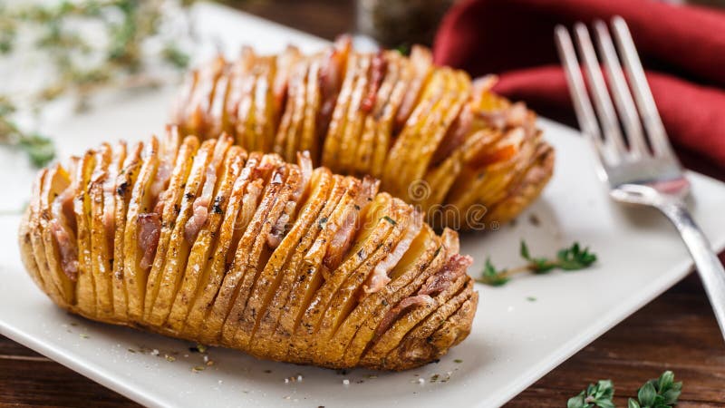 Hasselback potatoes on a plate. Hasselback potatoes on a plate