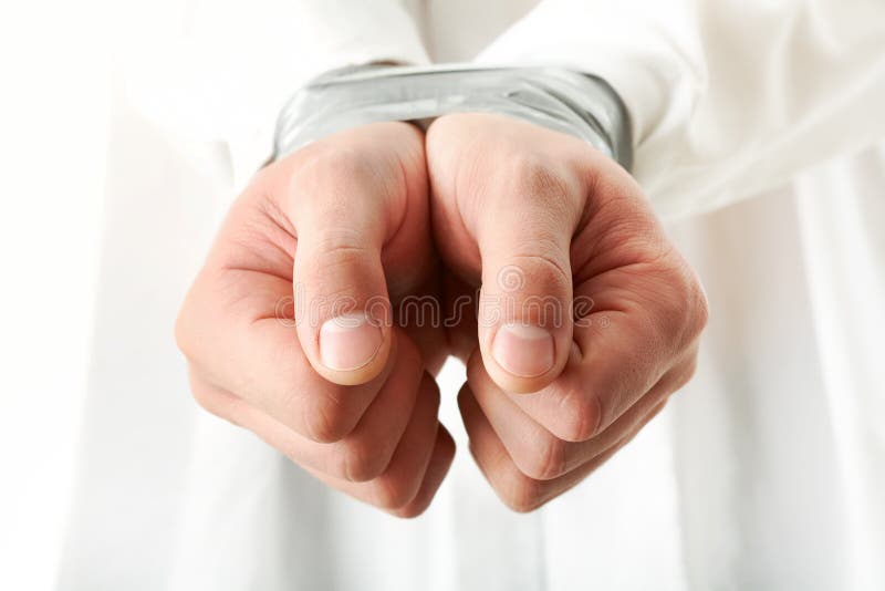 Photo of human hands bound with cellotape. Photo of human hands bound with cellotape