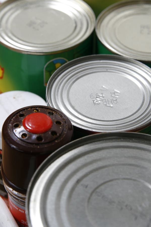 Close up of tops of tinned cans containing food. Close up of tops of tinned cans containing food.