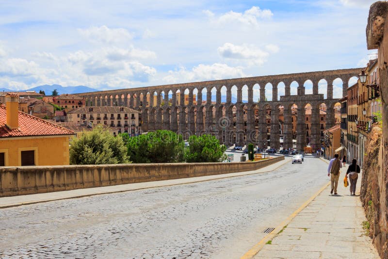 The Aqueduct of Segovia or the aqueduct bridge is a Roman aqueduct and one of the best-preserved elevated Roman aqueducts and the foremost symbol of Segovia, as evidenced by its presence on the city`s coat of arms. It was thought to have been built during the 1st century AD, during the reigns of the Emperors Domitian, Nerva, and Trajan. The aqueduct is built of unmortared, brick-like granite blocks and once transported water from the Rio Frio river, situated in mountains 17 km 11 mi from the city in the La Acebeda region. The Aqueduct of Segovia or the aqueduct bridge is a Roman aqueduct and one of the best-preserved elevated Roman aqueducts and the foremost symbol of Segovia, as evidenced by its presence on the city`s coat of arms. It was thought to have been built during the 1st century AD, during the reigns of the Emperors Domitian, Nerva, and Trajan. The aqueduct is built of unmortared, brick-like granite blocks and once transported water from the Rio Frio river, situated in mountains 17 km 11 mi from the city in the La Acebeda region.