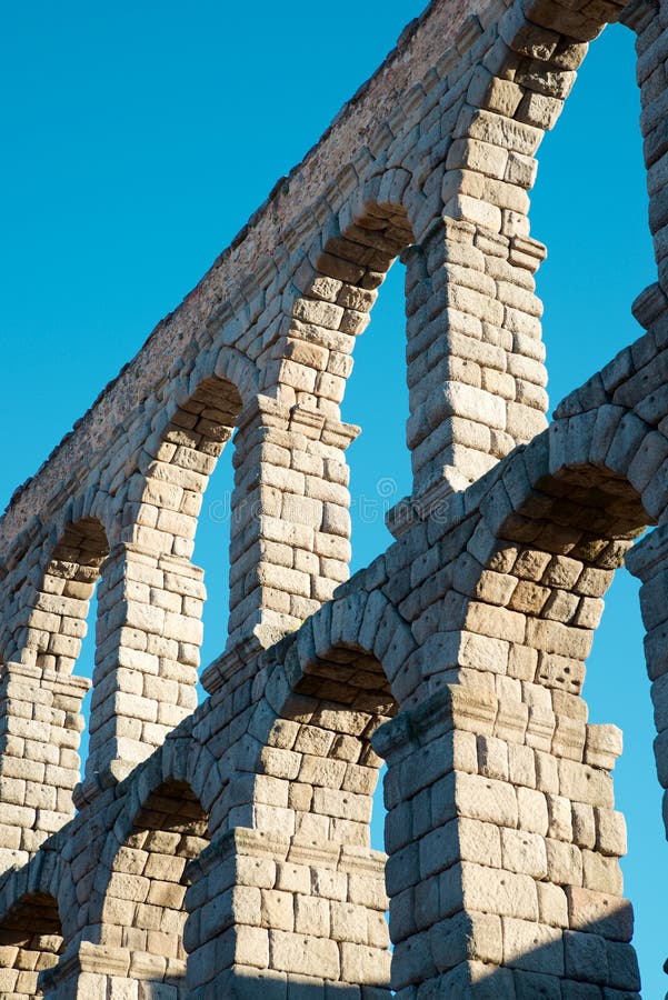 View from below the Roman aqueduct in the city of Segovia, Castilla Leon in Spain. View from below the Roman aqueduct in the city of Segovia, Castilla Leon in Spain