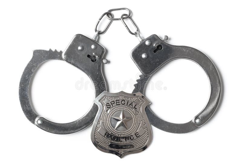 Locked handcuffs and special police badge isolated on white background. Locked handcuffs and special police badge isolated on white background.