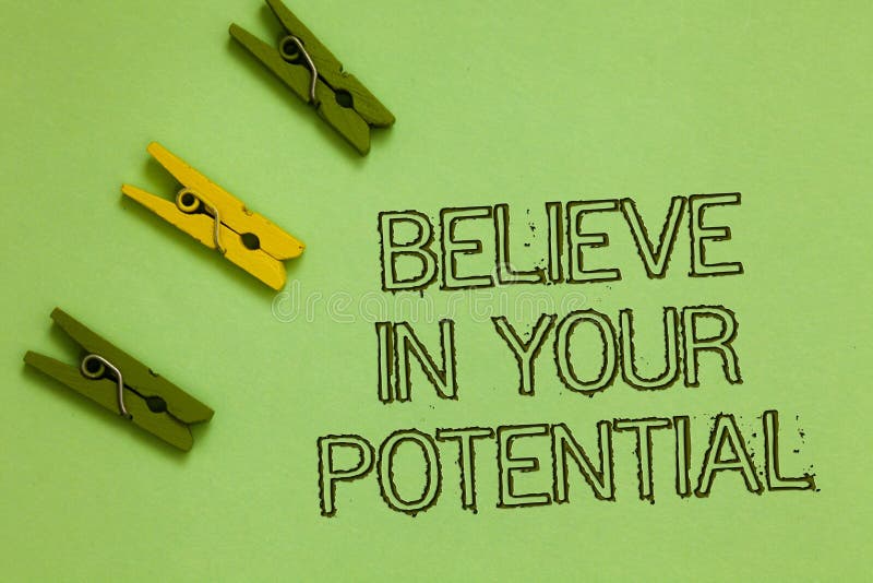 Word writing text Believe In Your Potential. Business concept for Have self-confidence motiavate inspire yourself Outline words green middle yellow paper clip on olive color ground. Word writing text Believe In Your Potential. Business concept for Have self-confidence motiavate inspire yourself Outline words green middle yellow paper clip on olive color ground