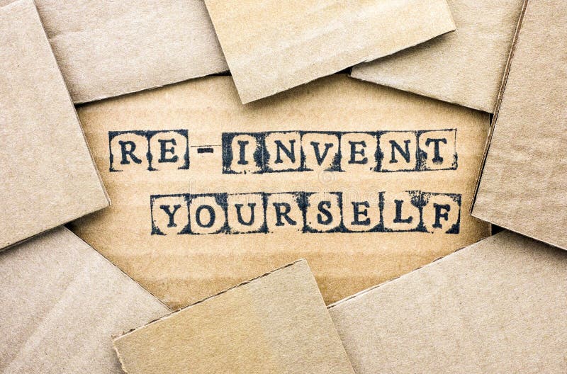 Words Re-invent Yourself make by black alphabet stamps on cardboard with some piece of cardboard. Words Re-invent Yourself make by black alphabet stamps on cardboard with some piece of cardboard.