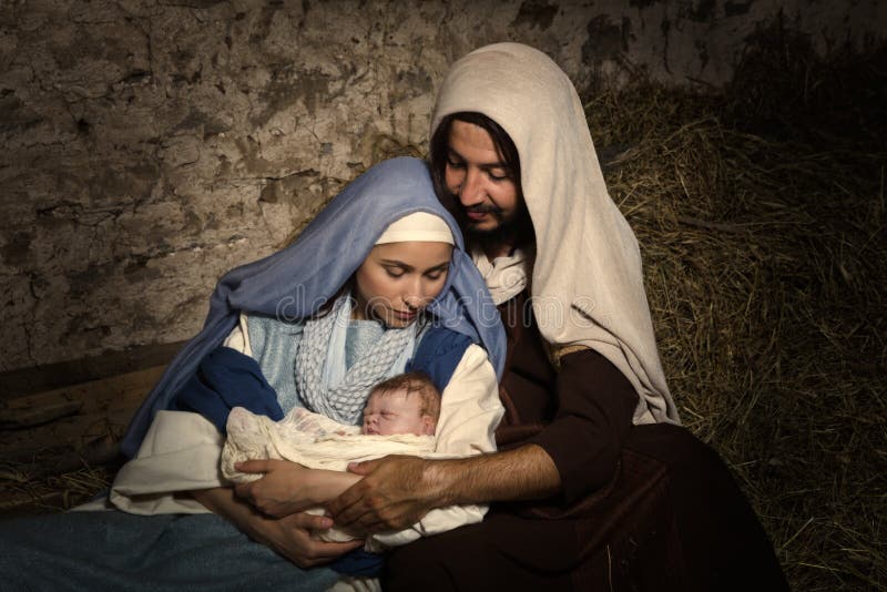 Live Christmas nativity scene in an old barn - Reenactment play with authentic costumes. The baby is a (property released) doll. Live Christmas nativity scene in an old barn - Reenactment play with authentic costumes. The baby is a (property released) doll.