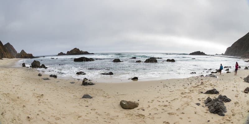 Pfeiffer Beach, California - May 01 : fiends enjoying a relaxing walk on the beach, May 01 2015 Pfeiffer beach, California. Pfeiffer Beach, California - May 01 : fiends enjoying a relaxing walk on the beach, May 01 2015 Pfeiffer beach, California.