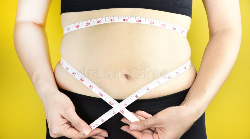 超重肥胖妇女，有过份腹部油脂的中年妇女 库存图片