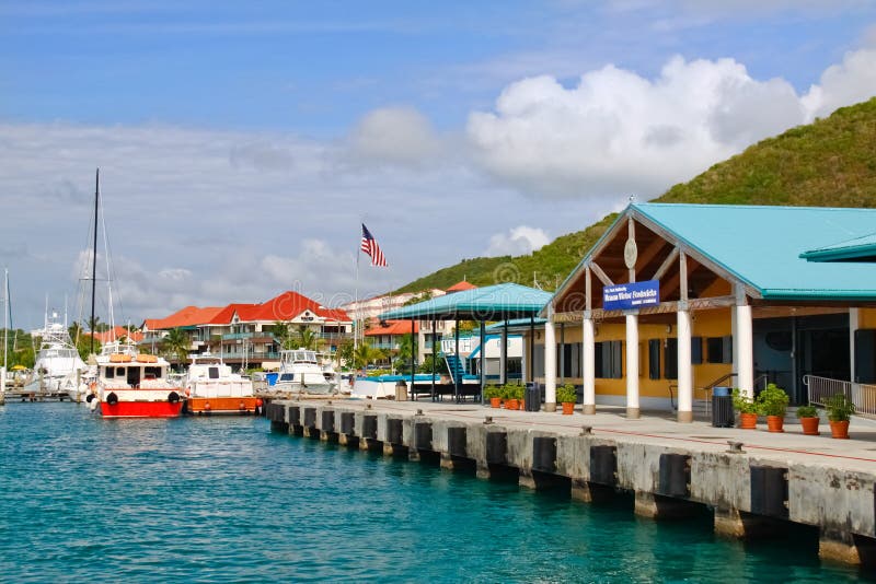 A colorful view of the port of Red Hook ferry terminal on the island of St. Thomas, in the US Virgin Islands. St. Thomas is the most popular cruise port in the Caribbean and a very popular resort destination as well. It's a fantastic place to persue outdoor recreation activities such as hiking, swimming, snorkeling, scuba diving, kayaking and fishing. A colorful view of the port of Red Hook ferry terminal on the island of St. Thomas, in the US Virgin Islands. St. Thomas is the most popular cruise port in the Caribbean and a very popular resort destination as well. It's a fantastic place to persue outdoor recreation activities such as hiking, swimming, snorkeling, scuba diving, kayaking and fishing.