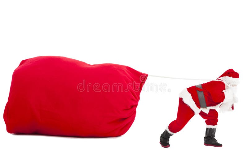 Santa claus carrying a heavy gift sack isolated. Santa claus carrying a heavy gift sack isolated