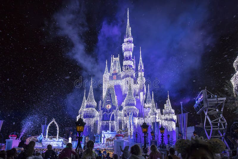 Disney`s Cinderella Castle, with Christmas icicles and confetti during A Frozen Holiday Wish spectacle. Disney`s Cinderella Castle, with Christmas icicles and confetti during A Frozen Holiday Wish spectacle