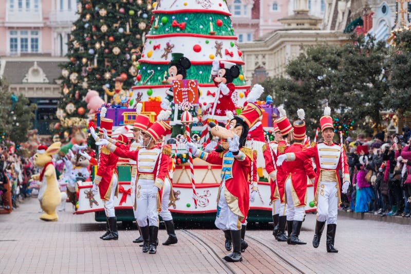 PARIS â€“ December 31, 2013 â€“ Disney Christmas Parade in Disneyland Paris. PARIS â€“ December 31, 2013 â€“ Disney Christmas Parade in Disneyland Paris.