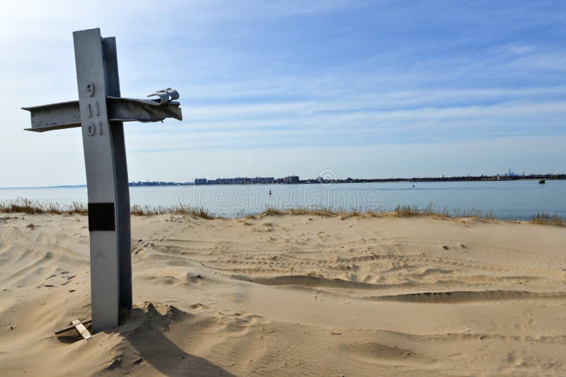 Breezy Point 9/11 Memorial, Queens, NY. Platform contains 29 glass etchings for each of the community members lost on 9/11 and a cross shaped piece of steel from WTC. Breezy Point 9/11 Memorial, Queens, NY. Platform contains 29 glass etchings for each of the community members lost on 9/11 and a cross shaped piece of steel from WTC.