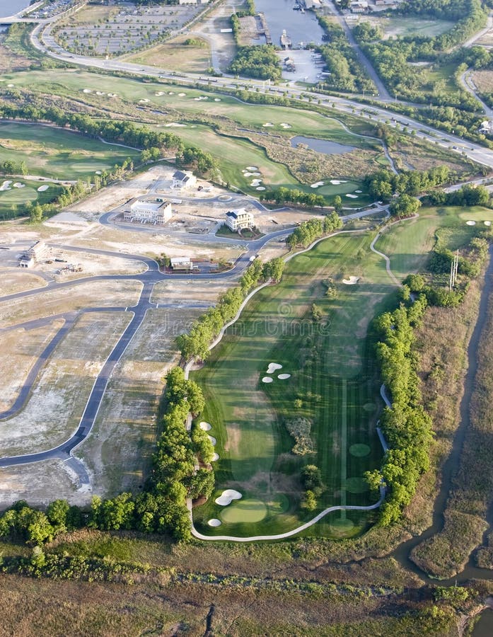 Aerial view of new development with golf course. Aerial view of new development with golf course