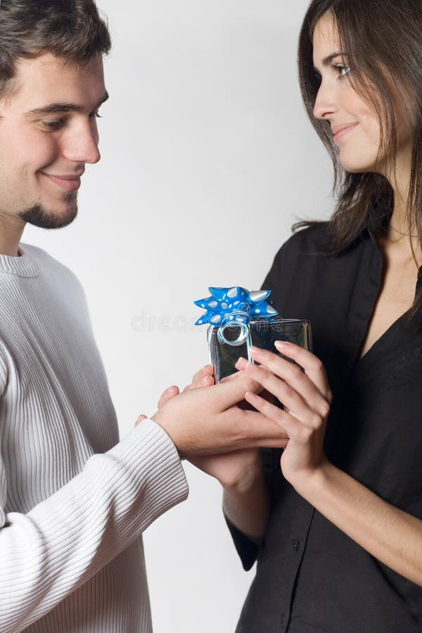 Young happy couple with gift box. Young happy couple with gift box