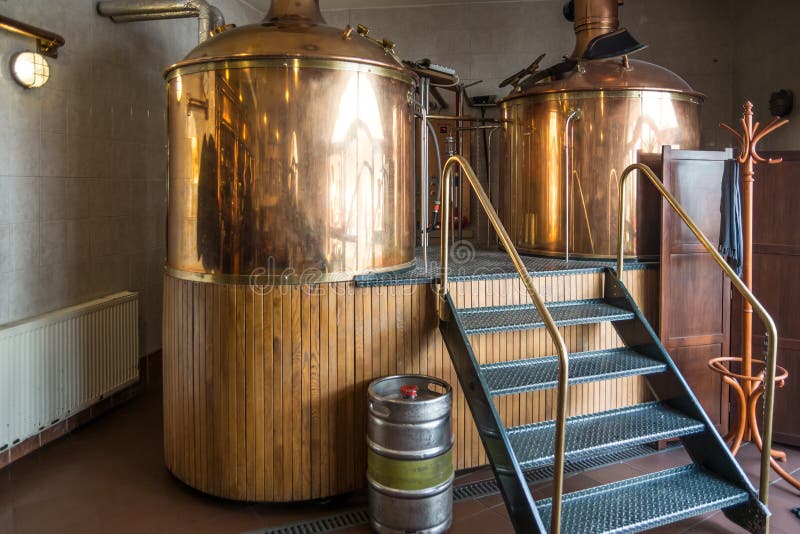 Line of two traditional brewing vessels in brewery. Line of two traditional brewing vessels in brewery.