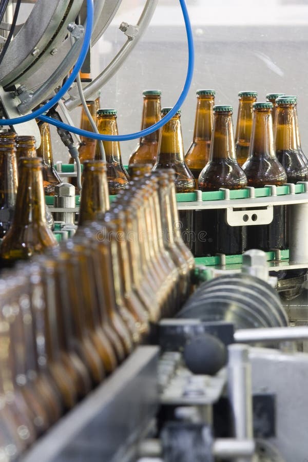 Filling and corking of the beer bottles. Filling and corking of the beer bottles