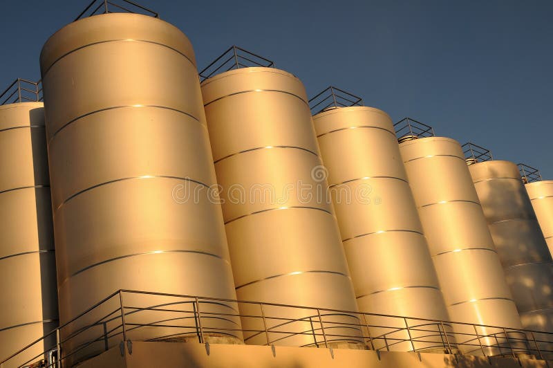 Brewery Storage Tanks Filled with Hops and Grain Extract. Brewery Storage Tanks Filled with Hops and Grain Extract
