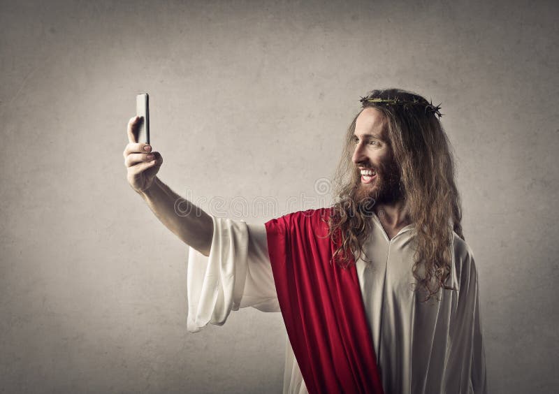 Jesus with a phone and taking a selfie. Jesus with a phone and taking a selfie