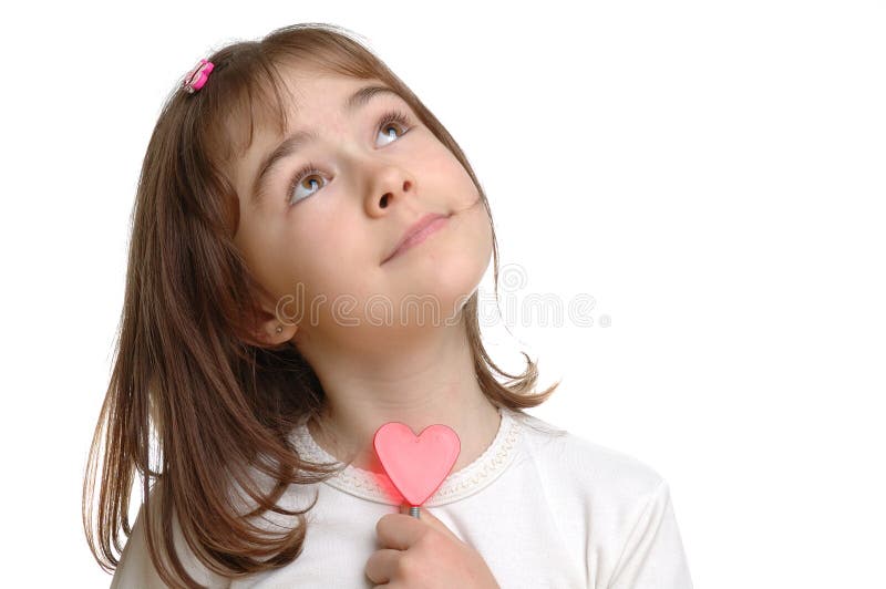 Young girl with red heart in hand. Young girl with red heart in hand