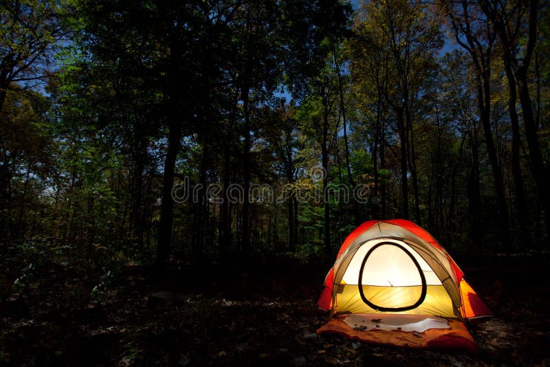 Camping at night under a full moon. Camping at night under a full moon