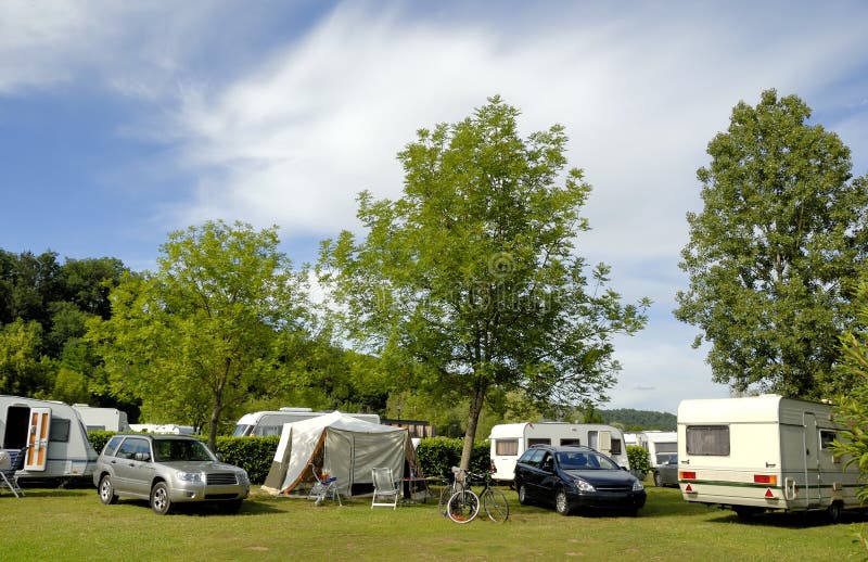 Camping in France with caravans between trees. Camping in France with caravans between trees