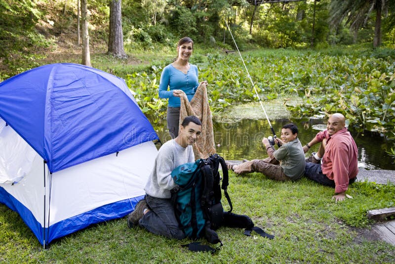 Hispanic family with two boys camping. Hispanic family with two boys camping