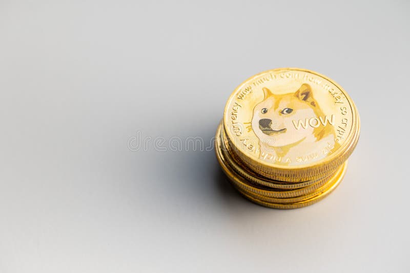 Golden dogecoin coin. Cryptocurrency dogecoin. Doge cryptocurrency on grey background. Golden dogecoin coin. Cryptocurrency dogecoin. Doge cryptocurrency on grey background