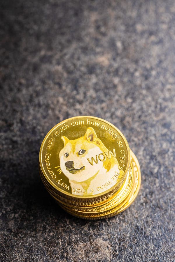 Golden dogecoin coin. Cryptocurrency dogecoin. Doge cryptocurrency on a black table. Golden dogecoin coin. Cryptocurrency dogecoin. Doge cryptocurrency on a black table