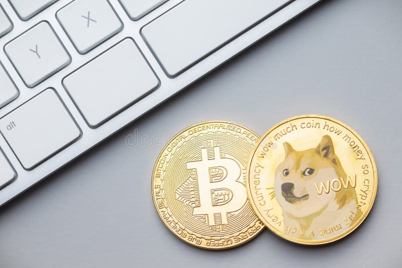 Golden dogecoin and a bitcoin coins. Cryptocurrency dogecoin. Doge cryptocurrency. Golden dogecoin and a bitcoin coins. Cryptocurrency dogecoin. Doge cryptocurrency