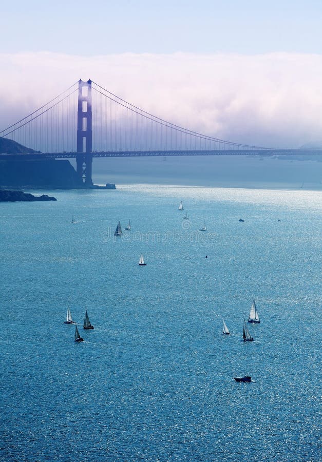 View of a Golden Gate bridge and boats in the bay. View of a Golden Gate bridge and boats in the bay