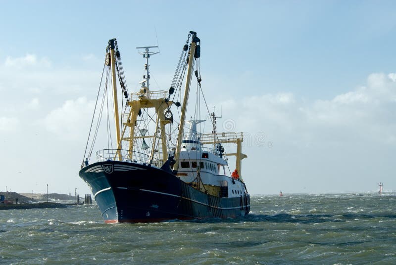 Fishing ship during a storm in harbor. Fishing ship during a storm in harbor