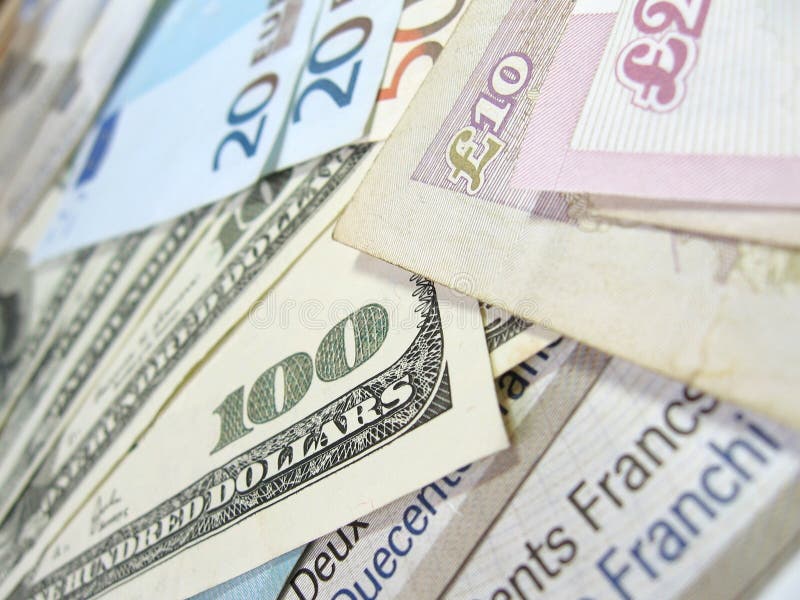 Close-up view of banknotes of various currencies (US dollars, British pounds, Euros and Swiss Francs), with selective focus. Close-up view of banknotes of various currencies (US dollars, British pounds, Euros and Swiss Francs), with selective focus.