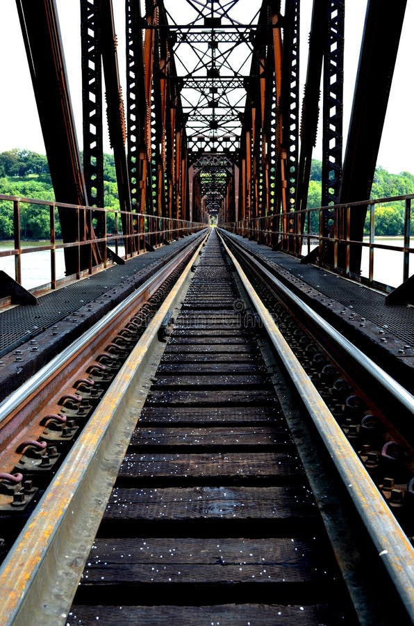 Early morning photograph of a train bridge crossing the Mississippi River at Dubuque, IA. Early morning photograph of a train bridge crossing the Mississippi River at Dubuque, IA.