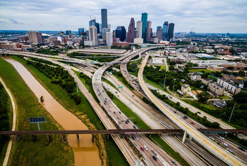 Urban Sprawl Bridge and Overpasses High Aerial Drone view over Houston Texas Urban Highway view High Aerial Drone view over Houston Texas Buffalo Bayou River over interstates and highways with the cityscape in the background. Urban Sprawl Bridge and Overpasses High Aerial Drone view over Houston Texas Urban Highway view High Aerial Drone view over Houston Texas Buffalo Bayou River over interstates and highways with the cityscape in the background.