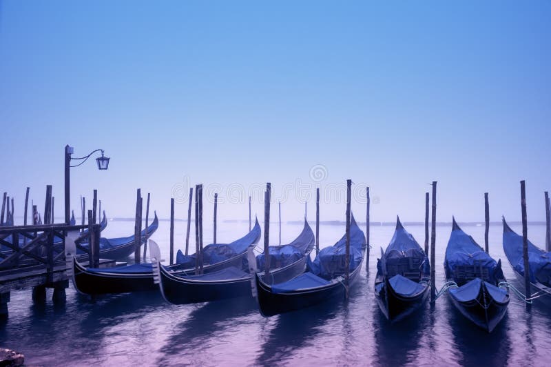 Gondolas in the morning fog, Venice - Italy. Gondolas in the morning fog, Venice - Italy