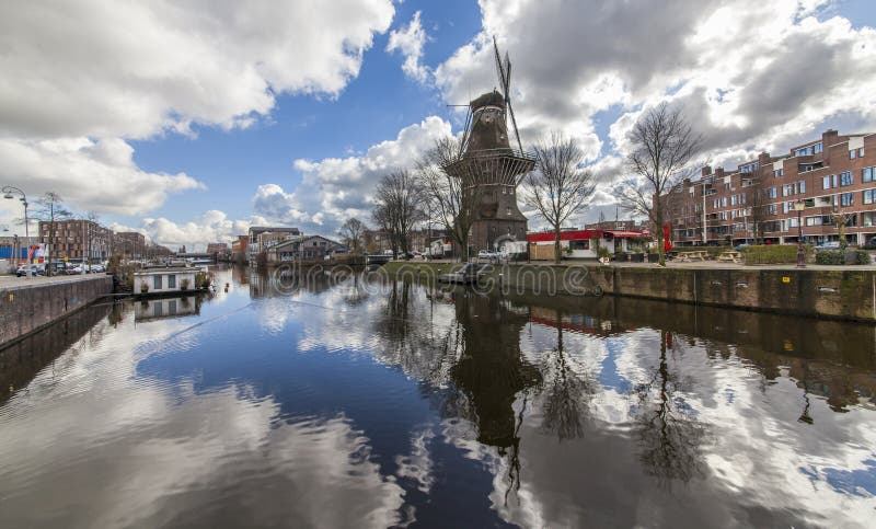 Windmill in the eastern part of Amsterdam. It is the largest wooden windmill in The Netherlands and next to it is a beer brewery. Windmill in the eastern part of Amsterdam. It is the largest wooden windmill in The Netherlands and next to it is a beer brewery