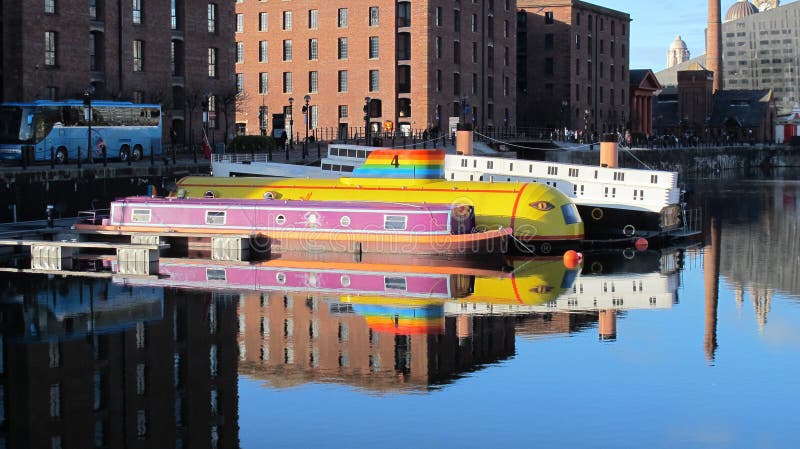 This picture was taken on a lovely very still day in January 2014.nnThe Albert Dock is a complex of dock buildings and warehouses in Liverpool, England. Designed by Jesse Hartley and Philip Hardwick, it was opened in 1846, and was the first structure in Britain to be built from cast iron, brick and stone, with no structural wood. As a result, it was the first non-combustible warehouse system in the world.[1]nnAt the time of its construction the Albert Dock was considered a revolutionary docking system because ships were loaded and unloaded directly from/to the warehouses. Two years after it opened it was modified to feature the world's first hydraulic cranes.[2] Due to its open yet secure design, the Albert Dock became a popular store for valuable cargoes such as brandy, cotton, tea, silk, tobacco, ivory and sugar. However, despite the Albert Dock's advanced design, the rapid development of shipping technology meant that within 50 years, larger, more open docks were required, although it remained a valuable store for cargo. This picture was taken on a lovely very still day in January 2014.nnThe Albert Dock is a complex of dock buildings and warehouses in Liverpool, England. Designed by Jesse Hartley and Philip Hardwick, it was opened in 1846, and was the first structure in Britain to be built from cast iron, brick and stone, with no structural wood. As a result, it was the first non-combustible warehouse system in the world.[1]nnAt the time of its construction the Albert Dock was considered a revolutionary docking system because ships were loaded and unloaded directly from/to the warehouses. Two years after it opened it was modified to feature the world's first hydraulic cranes.[2] Due to its open yet secure design, the Albert Dock became a popular store for valuable cargoes such as brandy, cotton, tea, silk, tobacco, ivory and sugar. However, despite the Albert Dock's advanced design, the rapid development of shipping technology meant that within 50 years, larger, more open docks were required, although it remained a valuable store for cargo.