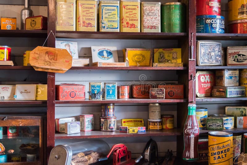 Vernon, British Columbia/Canada - October 23, 2016: tins of vintage dry goods displayed on shelves in the general store at O`Keefe Ranch, a popular tourist attraction. Vernon, British Columbia/Canada - October 23, 2016: tins of vintage dry goods displayed on shelves in the general store at O`Keefe Ranch, a popular tourist attraction