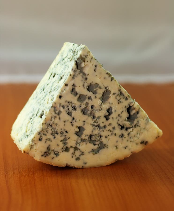 Blue cheese on wooden surface (small dof). Blue cheese on wooden surface (small dof)