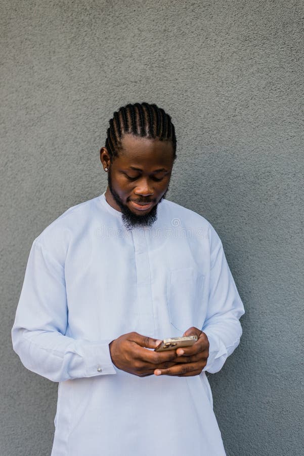 African american man checks cell phone in the street cafe in summer day. Millennial generation and gen z people. Social networks and dating app. African american man checks cell phone in the street cafe in summer day. Millennial generation and gen z people. Social networks and dating app