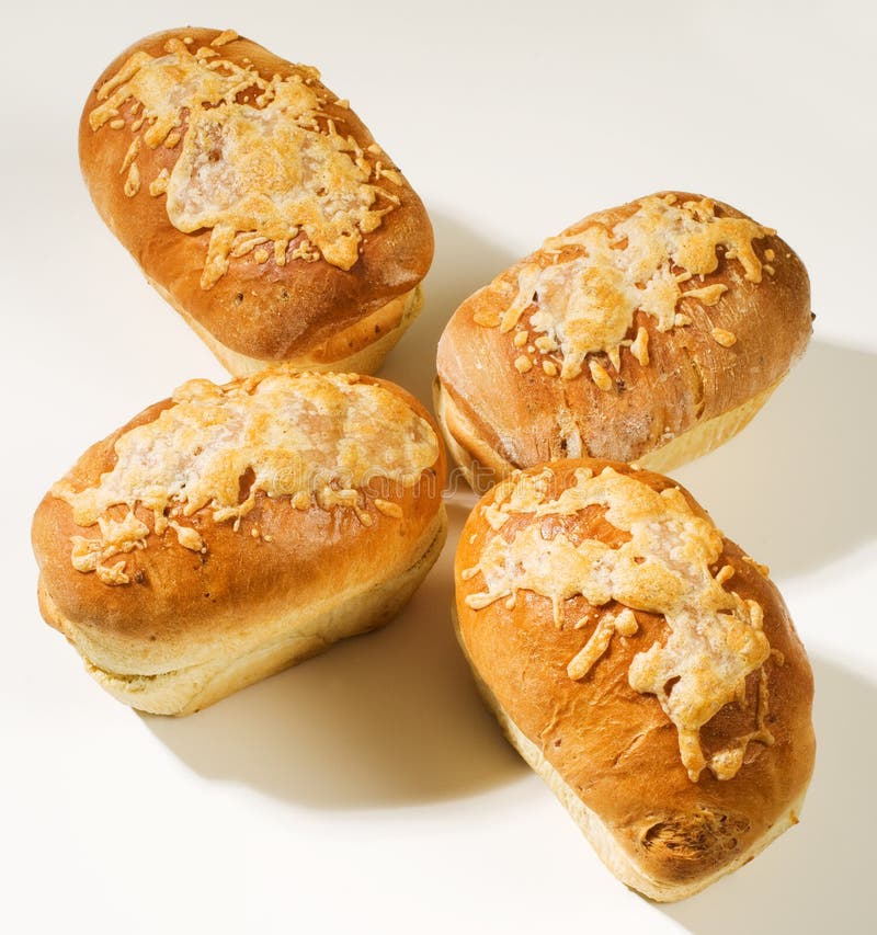 Four cheese bread loaves. Against a white background. Four cheese bread loaves. Against a white background.