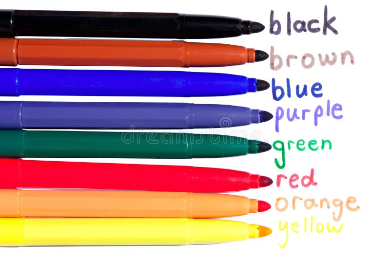 Eight uncapped felt tip pens with the words of different colors to aid in learning. Eight uncapped felt tip pens with the words of different colors to aid in learning