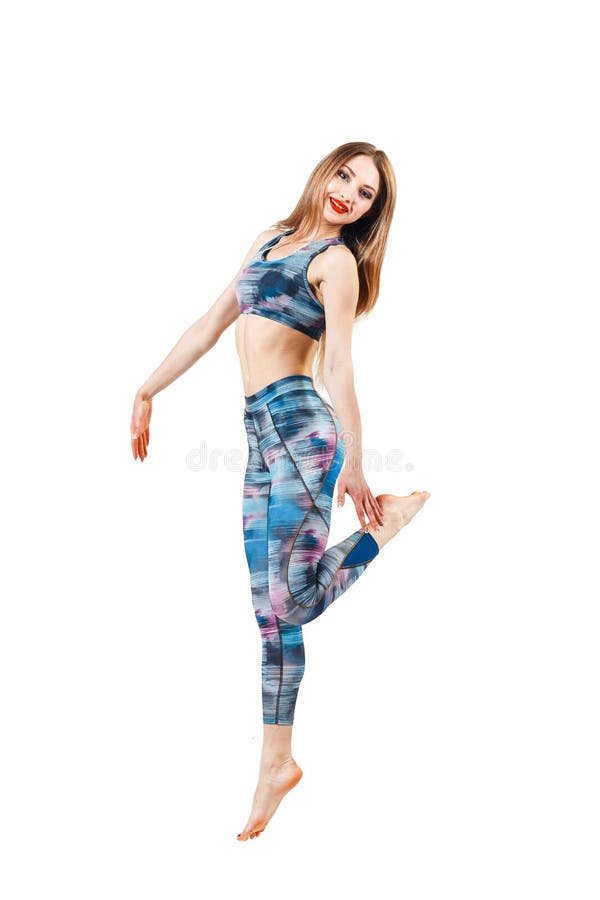 颜色蓝色上面和绑腿跳跃的年轻美丽的妇女喜悦 在白色背景隔绝的年轻运动的适合emale模型 免版税库存照片 颜色蓝色上面和绑腿跳跃的年轻美丽的妇女喜悦 在白色背景隔绝的年轻运动的适合emale模型 免版税库存照片