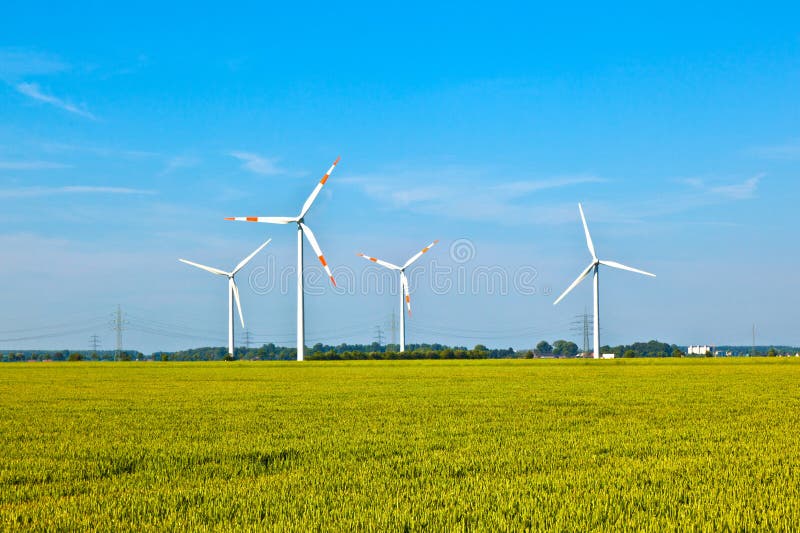 Wind energy wowers standing in the field in spring. Wind energy wowers standing in the field in spring