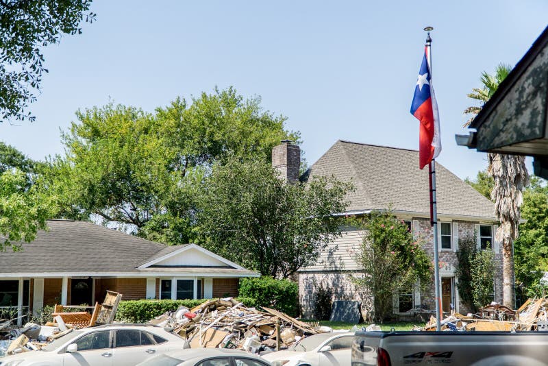 Texas flag outside of a Houston area home devastated after Hurricane Harvey. Texas flag outside of a Houston area home devastated after Hurricane Harvey