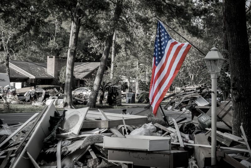 American flag standing outside Houston area home devastated after Hurricane Harvey. American flag standing outside Houston area home devastated after Hurricane Harvey