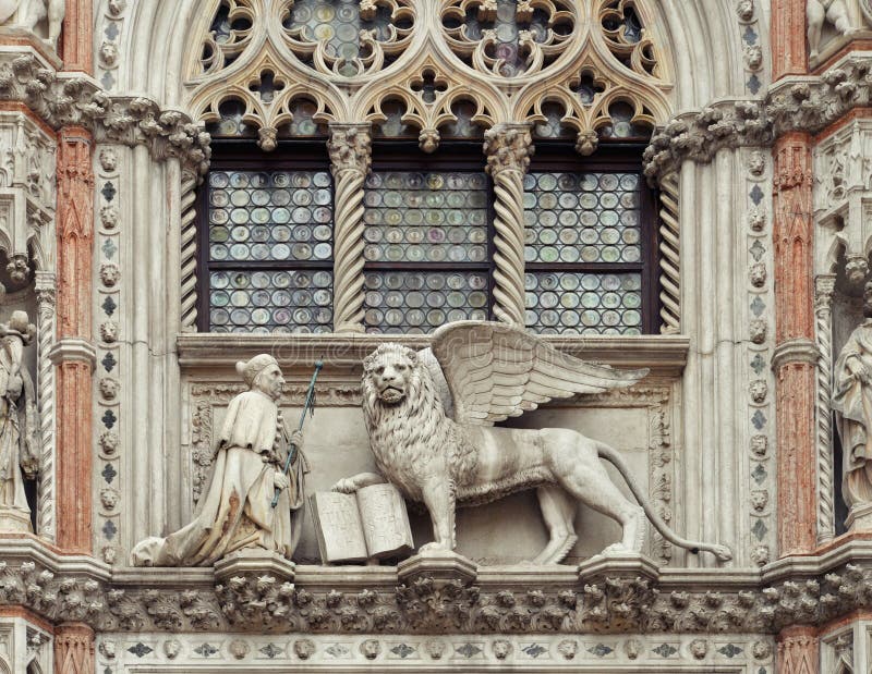 The Doge`s Palace and Paper Gate porta della Carta. Sculptures of the winged Lion and the Doge Francesco Foscari in St. Mark`s Square , Venice, Italy. The Doge`s Palace and Paper Gate porta della Carta. Sculptures of the winged Lion and the Doge Francesco Foscari in St. Mark`s Square , Venice, Italy