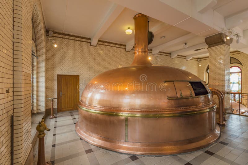 Old traditional copper mash tun for brewing beers with barrel stainless, factory ingredients, brewery, pot. Old traditional copper mash tun for brewing beers with barrel stainless, factory ingredients, brewery, pot