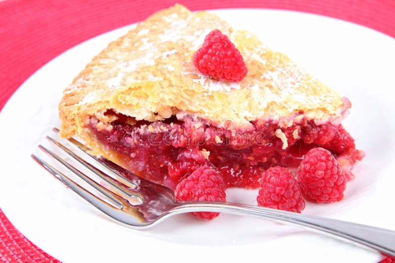 A slice of fresh homemade raspberry pie. A slice of fresh homemade raspberry pie.